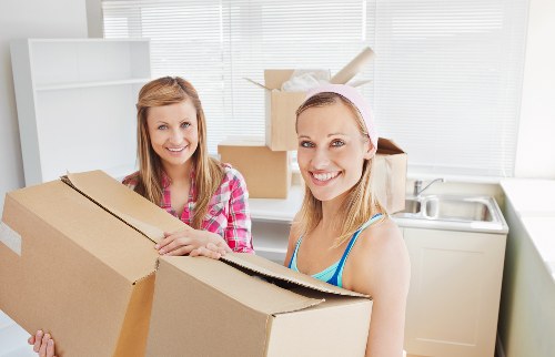 Removalists loading furniture onto truck